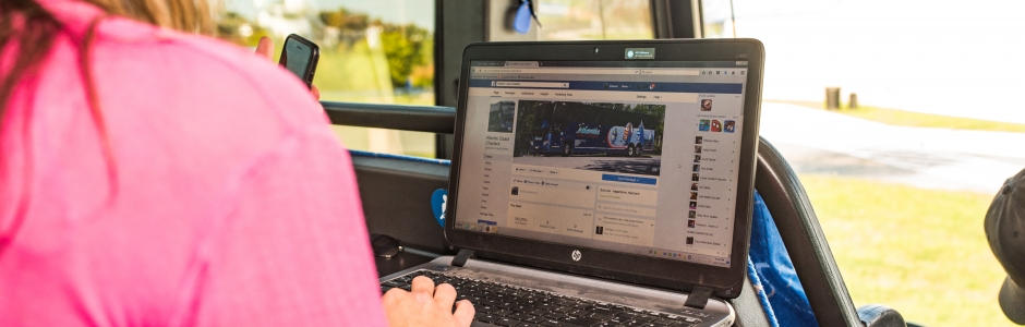 bus passenger on laptop