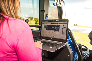 bus passenger with laptop